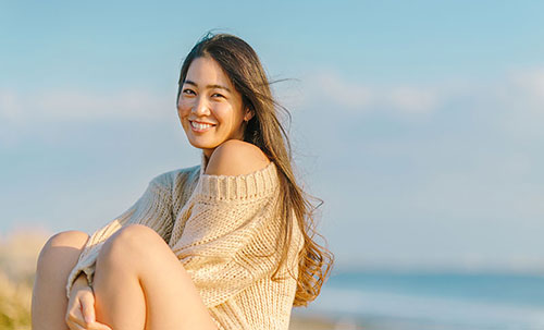 Young lady smile at the beach