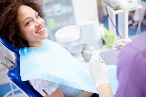 Woman getting dental exam at Encinitas Periodontics & Dental Implants in Encinitas, CA
